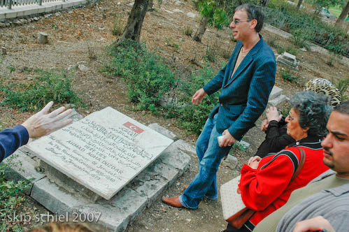 Recently uncovered and renovated tomb, newly desecrated--this man is the grandson of the buried and one of the organizers of the refreshed cemetery