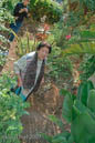 Former resident at her home picking grapefruit