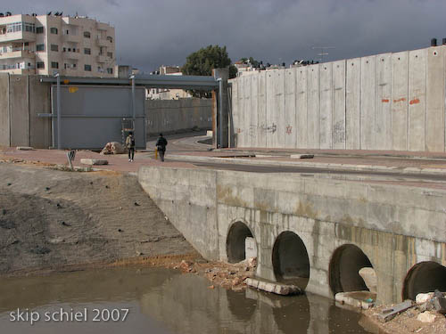 Gate can be closed to seal East Jerusalem, in which case Palestinians (in dry weather) move thru the drainage tunnels