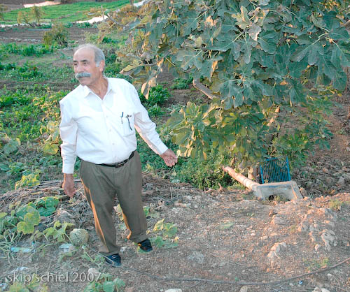 Village elder explaining hydrological device